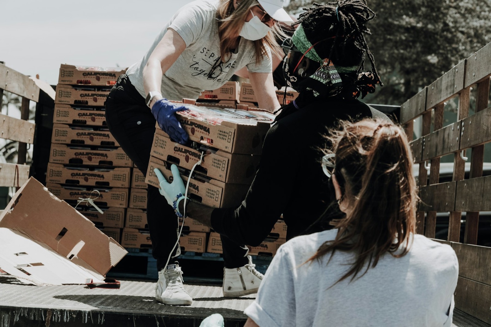 Volunteers loading donation boxes for community outreach